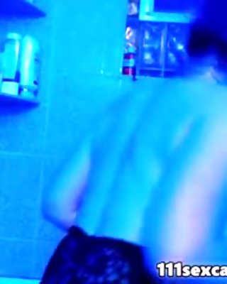 Juicy camgirl in bathroom in front of a webcam