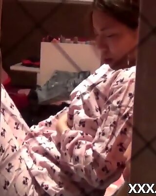 Japanese babe in pajamas fingers pussy in hot solo